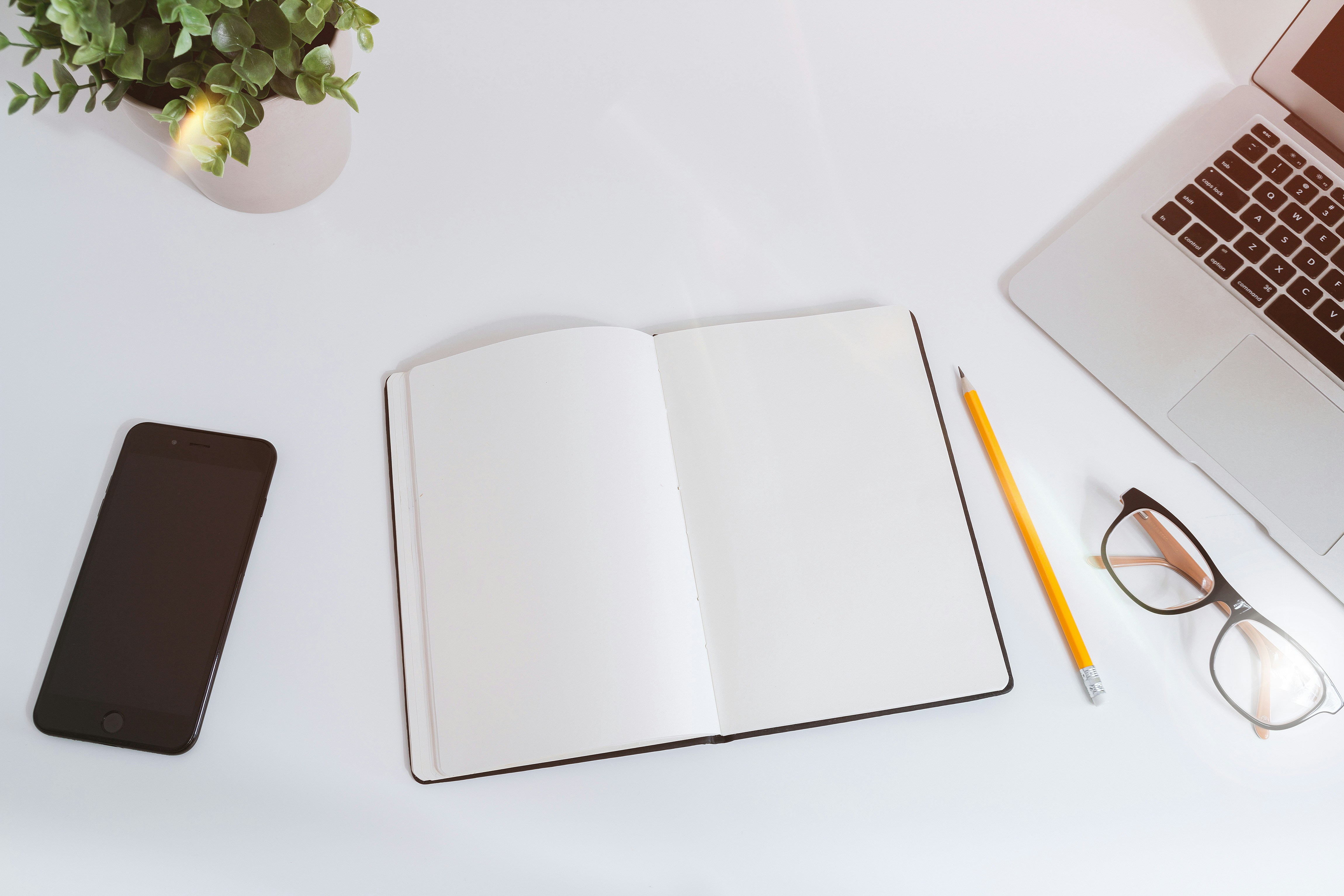 note pad, phone, and pen